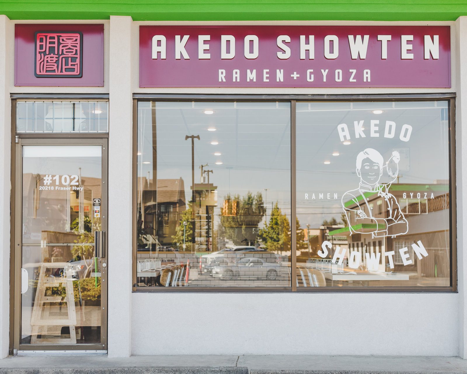 The Akedo Showten Ramen + Gyoza storefront, unit 102, with the shop's name on a red sign over the window