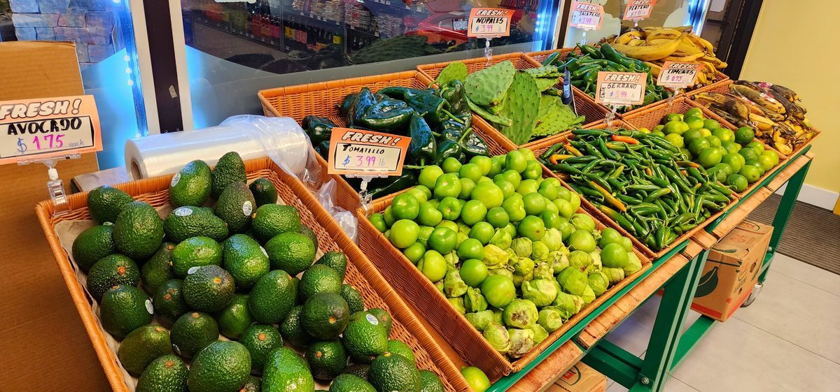 Baskets of avocados, limes and green beans in Los Guerreros' produce section