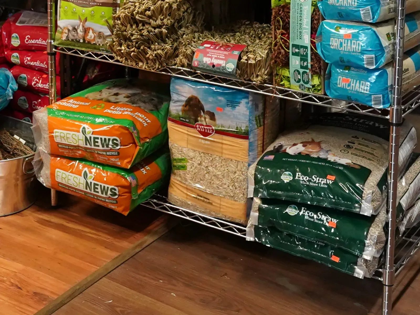 Shelves of bagged small-animal bedding, hay and litter at Milner Feed