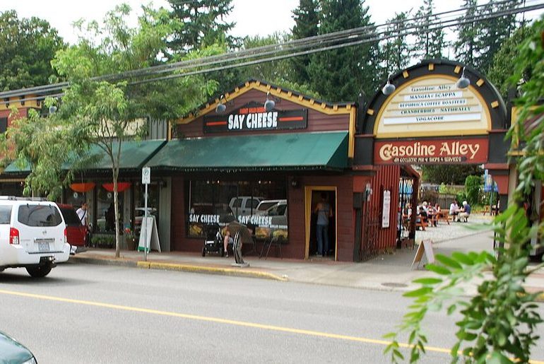Heritage shopfronts along Glover Road in Fort Langley, including Gasoline Alley, with cars parked out front