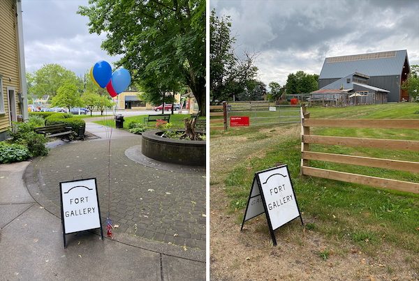 Two Fort Gallery sandwich boards, one on a Fort Langley sidewalk with balloons and one beside a wooden fence in front of a barn