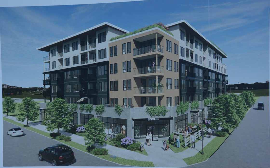 A rendering board at the September 2025 groundbreaking showing the planned rental building at Fraser Highway and 272 Street