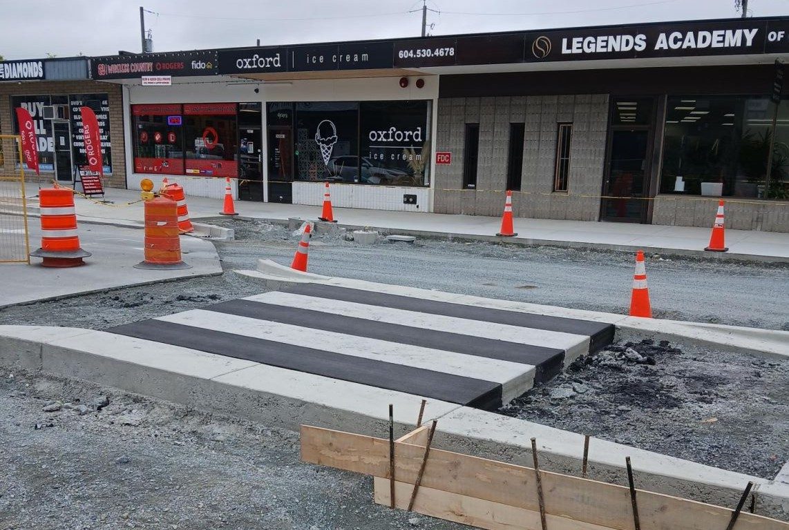 Shopfronts on the Fraser Highway One-Way in downtown Langley City, including Oxford Ice Cream, photographed during the 2025 street rebuild