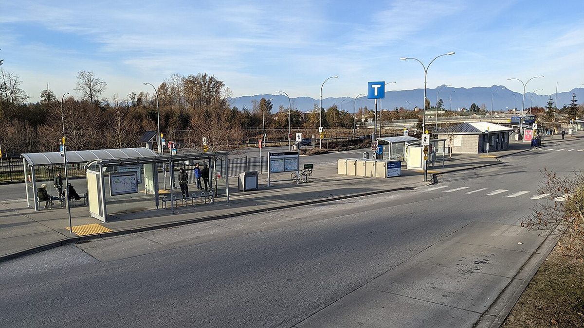 Bus shelters and bays at Carvolth Exchange in Langley, seen from the southeast with the North Shore mountains in the distance