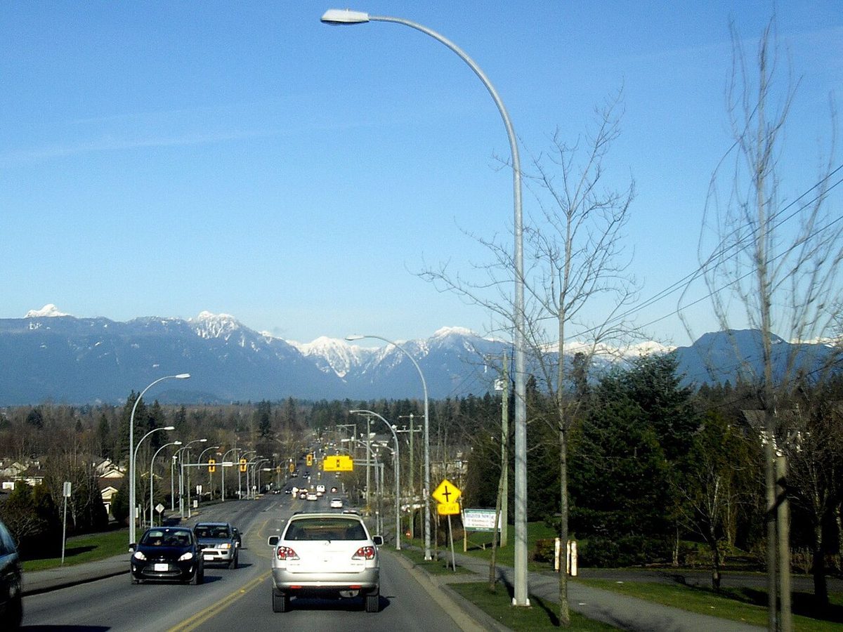 Walnut Grove with the Coast Mountains behind it; a black bear wandered through back yards here in June 2026