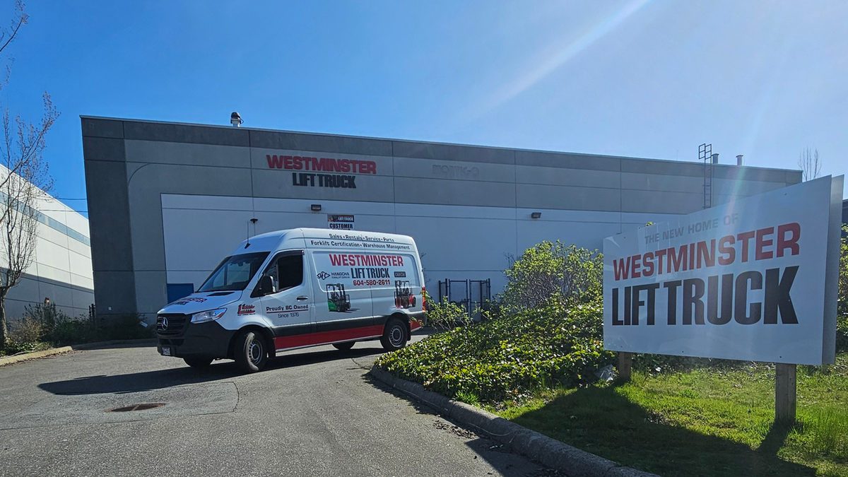 The front of the Westminster Lift Truck building on Gloucester Way, with a company service van parked outside