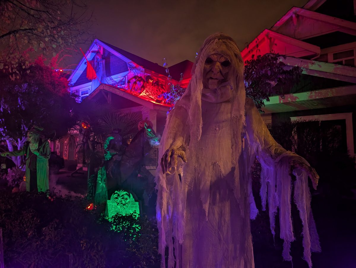 A tall ghostly wraith in a glowing graveyard