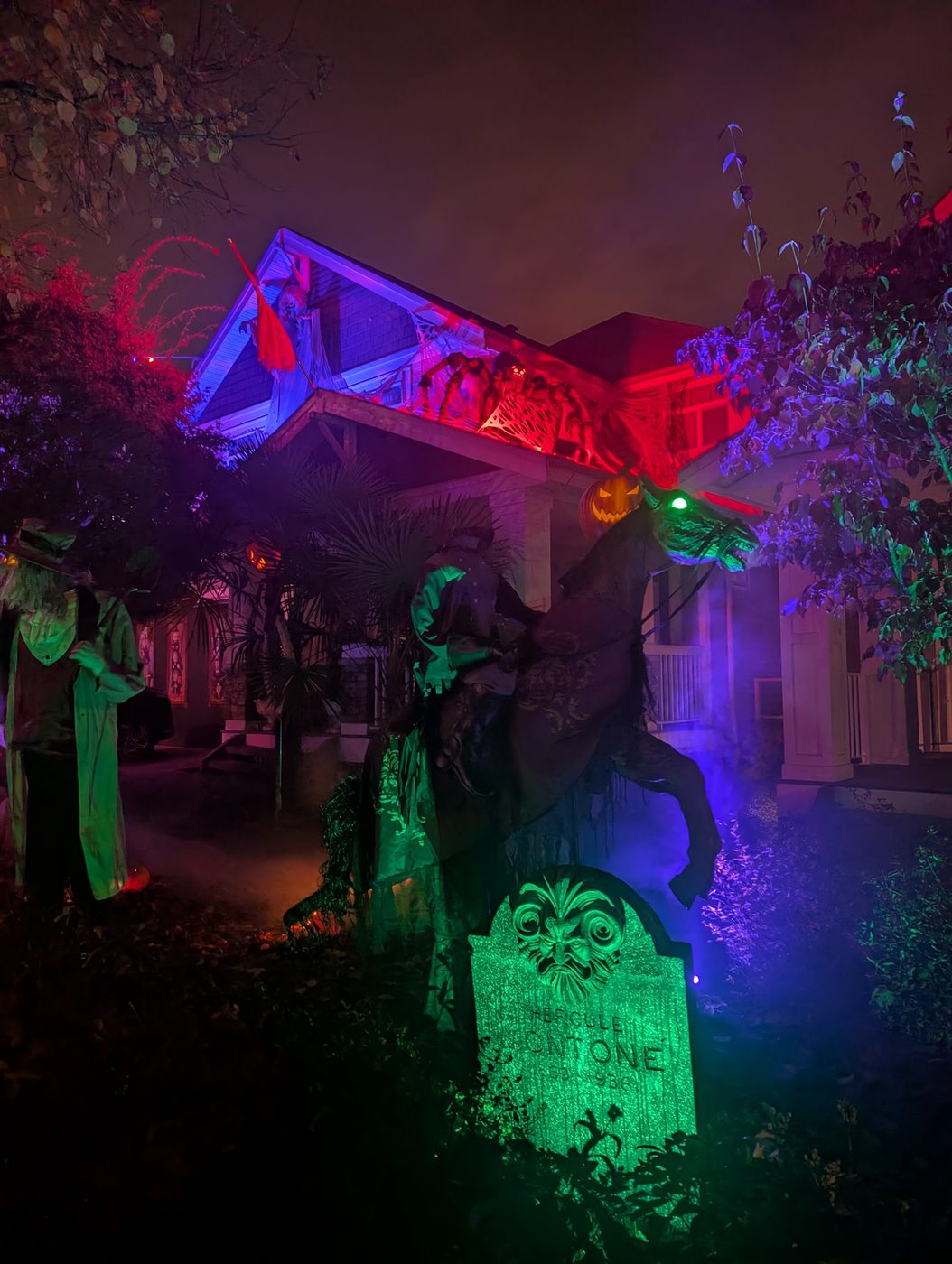 Green tombstones under a red and blue roofline