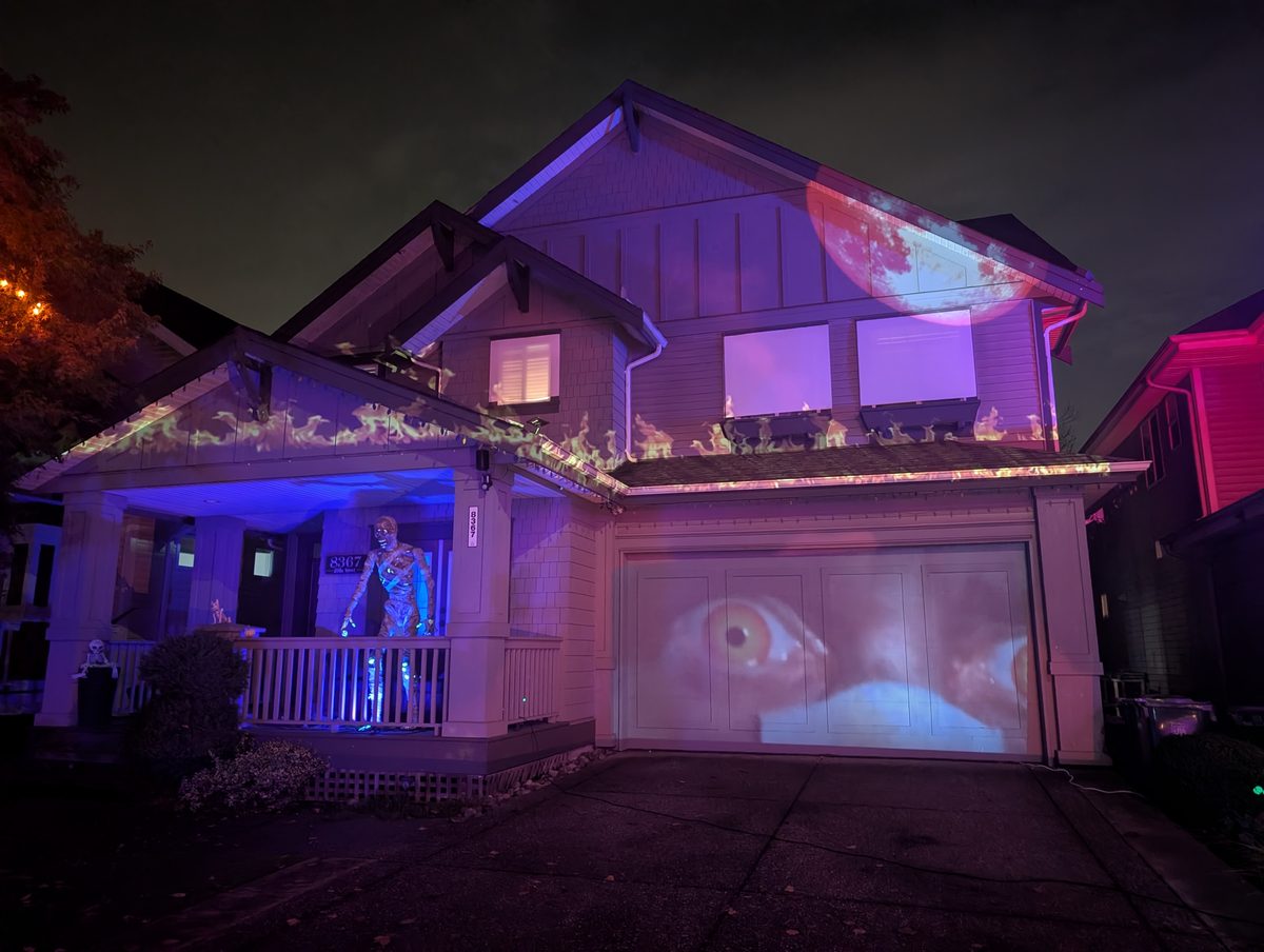 A giant eye projected on a garage door