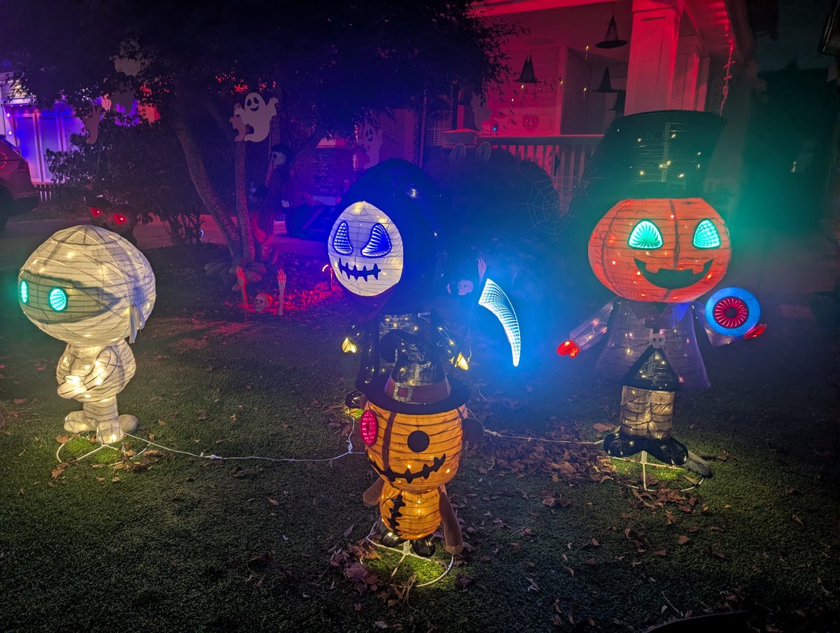 A row of glowing pumpkin-head buddies
