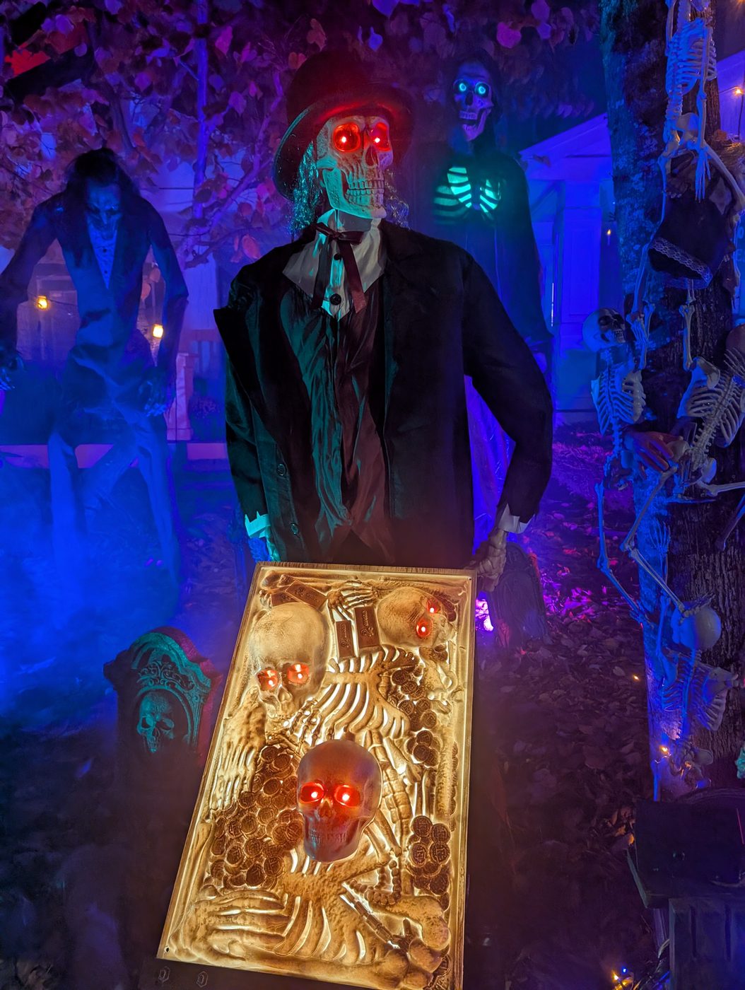 A red-eyed undertaker with a tray of skulls