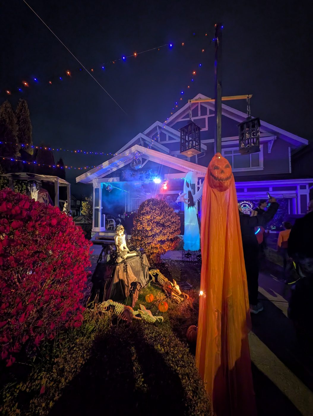 An orange ghost under the string lights
